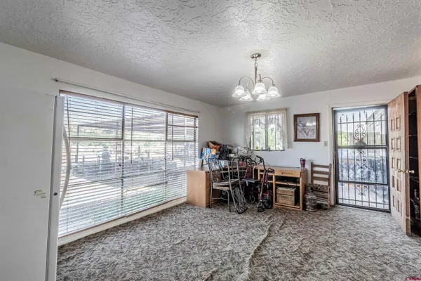 a view of a livingroom with furniture window and outside view