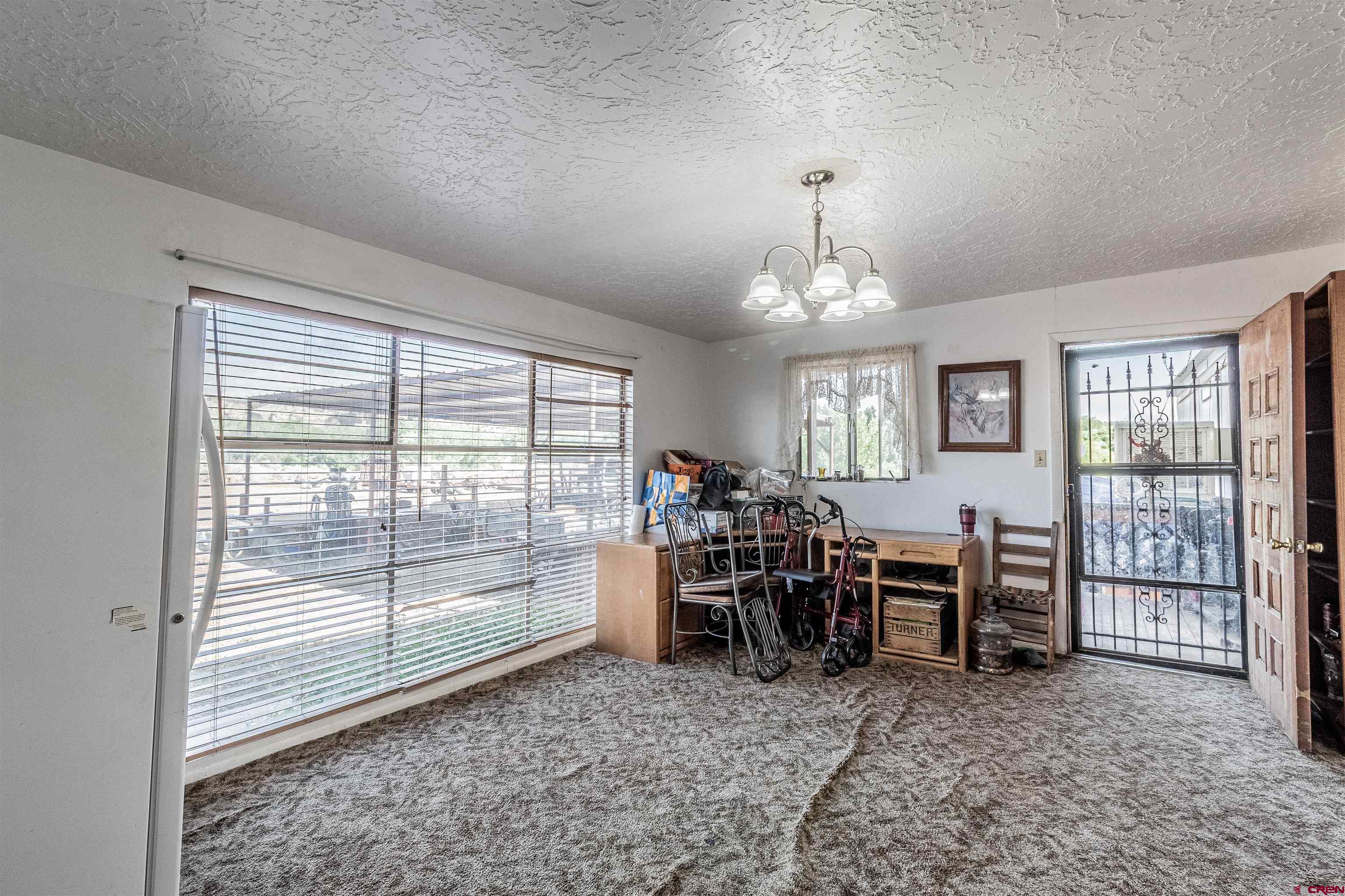 16923 Highway 550 Aztec, NM 87410 - Photo 10 of 45 a view of a livingroom with furniture window and outside view