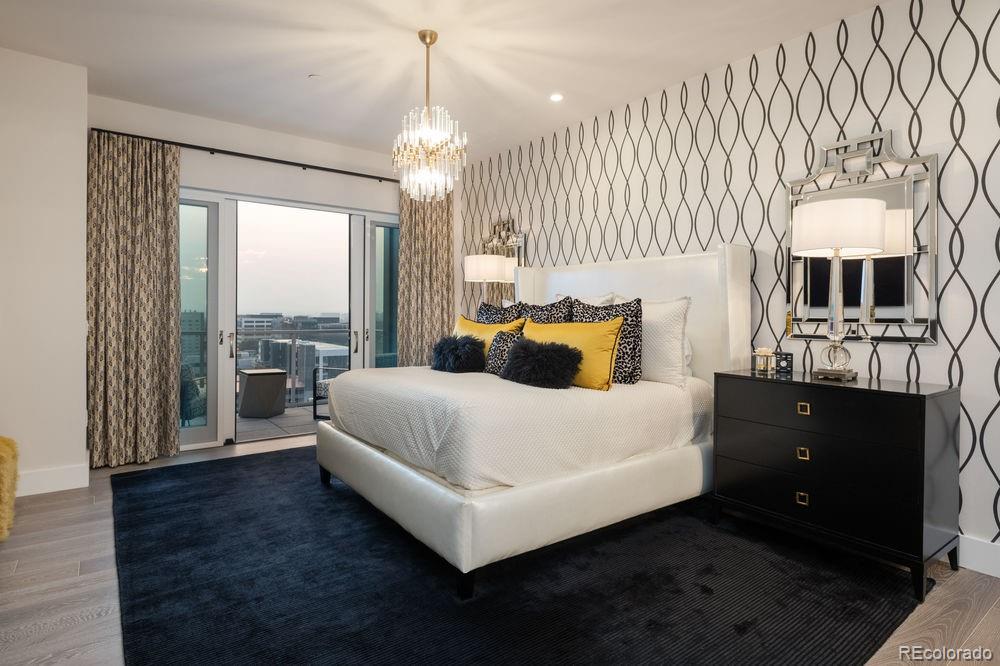 155 Steele Street, Unit 1117 Denver, CO 80206 - Photo 15 of 40 a spacious bedroom with a bed and window