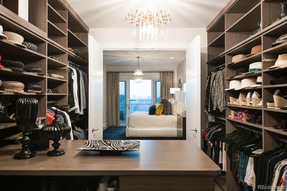 155 Steele Street, Unit 1117 Denver, CO 80206 - Photo 18 of 40 a living room with lots of furniture and a gym equipment