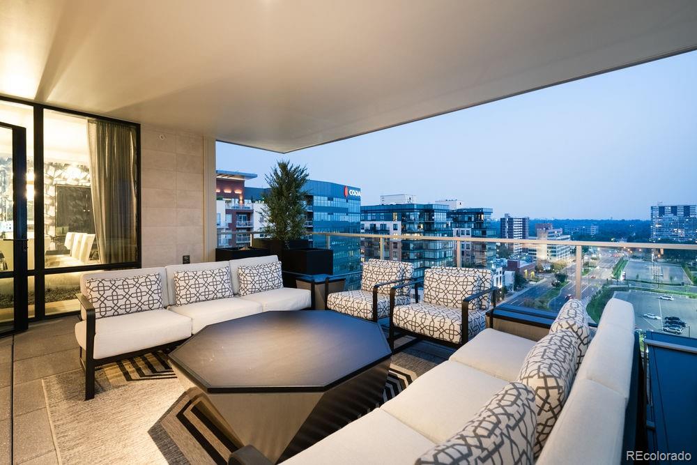 155 Steele Street, Unit 1117 Denver, CO 80206 - Photo 2 of 40 a living room with furniture and a floor to ceiling window