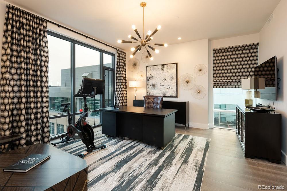 155 Steele Street, Unit 1117 Denver, CO 80206 - Photo 25 of 40 a view of kitchen with kitchen island granite countertop a refrigerator dining table and chairs