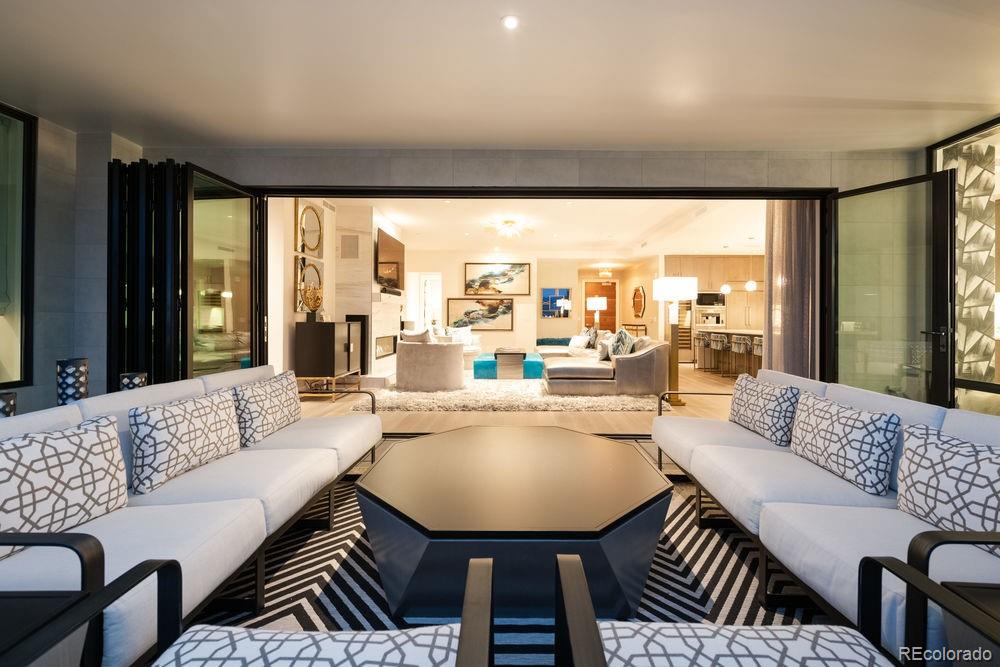 155 Steele Street, Unit 1117 Denver, CO 80206 - Photo 28 of 40 a living room with furniture and a large window