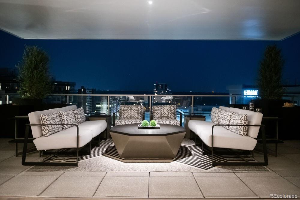 155 Steele Street, Unit 1117 Denver, CO 80206 - Photo 29 of 40 a living room with furniture and a couch