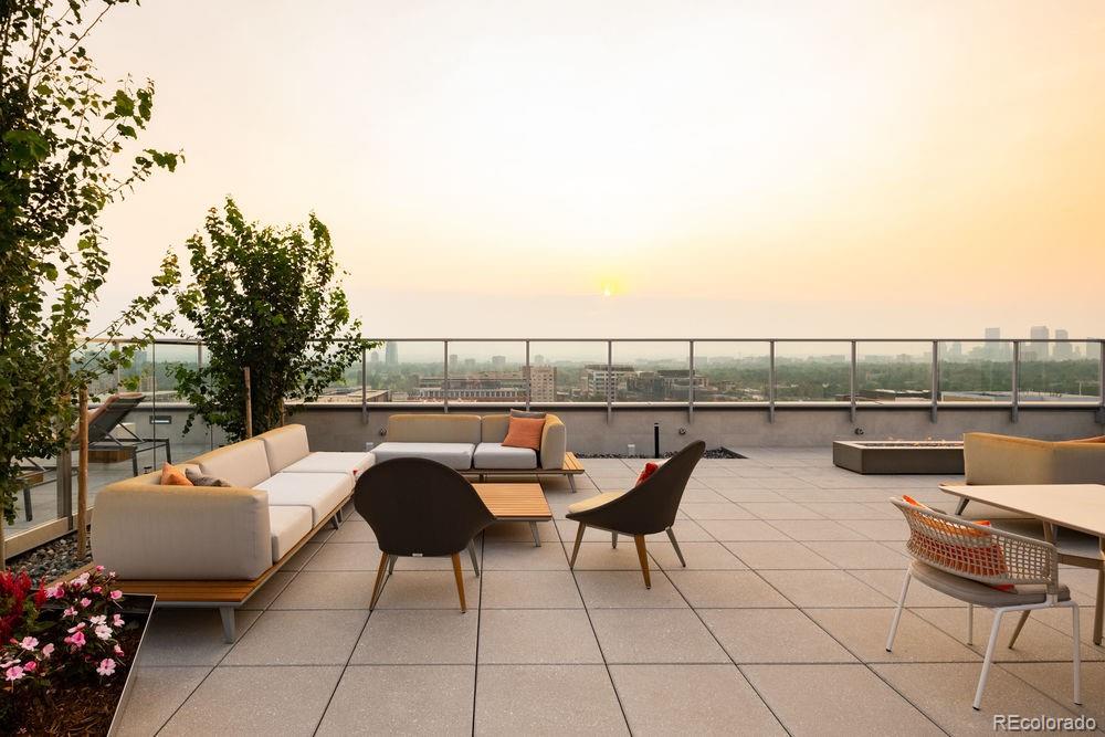 155 Steele Street, Unit 1117 Denver, CO 80206 - Photo 32 of 40 a balcony with chairs and a table