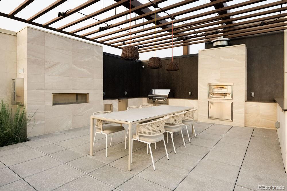 155 Steele Street, Unit 1117 Denver, CO 80206 - Photo 33 of 40 a outdoor dining space with furniture