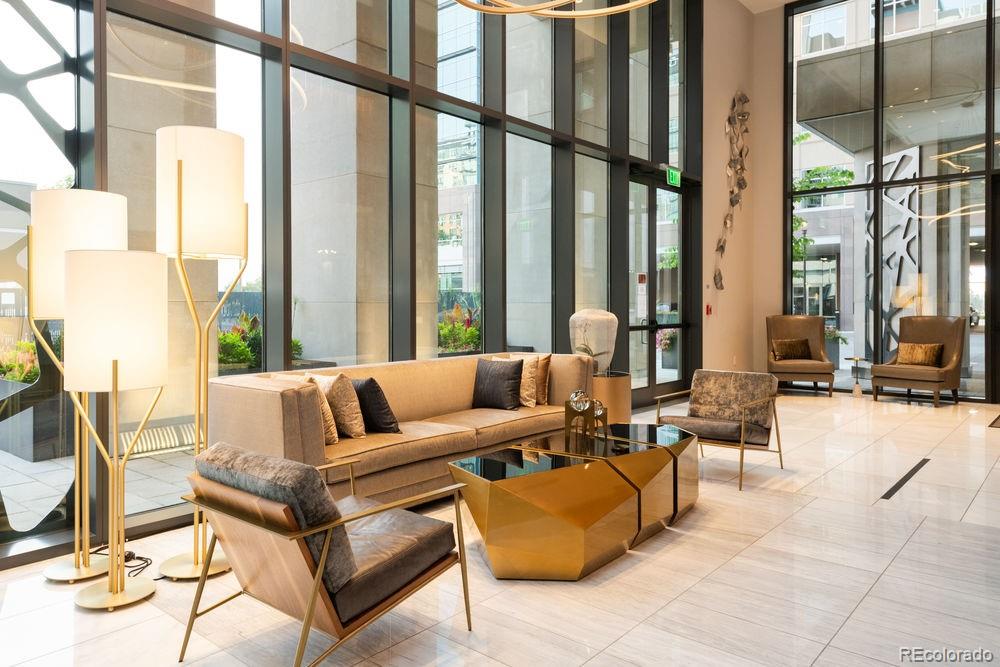 155 Steele Street, Unit 1117 Denver, CO 80206 - Photo 39 of 40 a living room with furniture and a large window