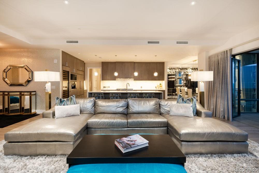 155 Steele Street, Unit 1117 Denver, CO 80206 - Photo 8 of 40 a living room with furniture and a fireplace