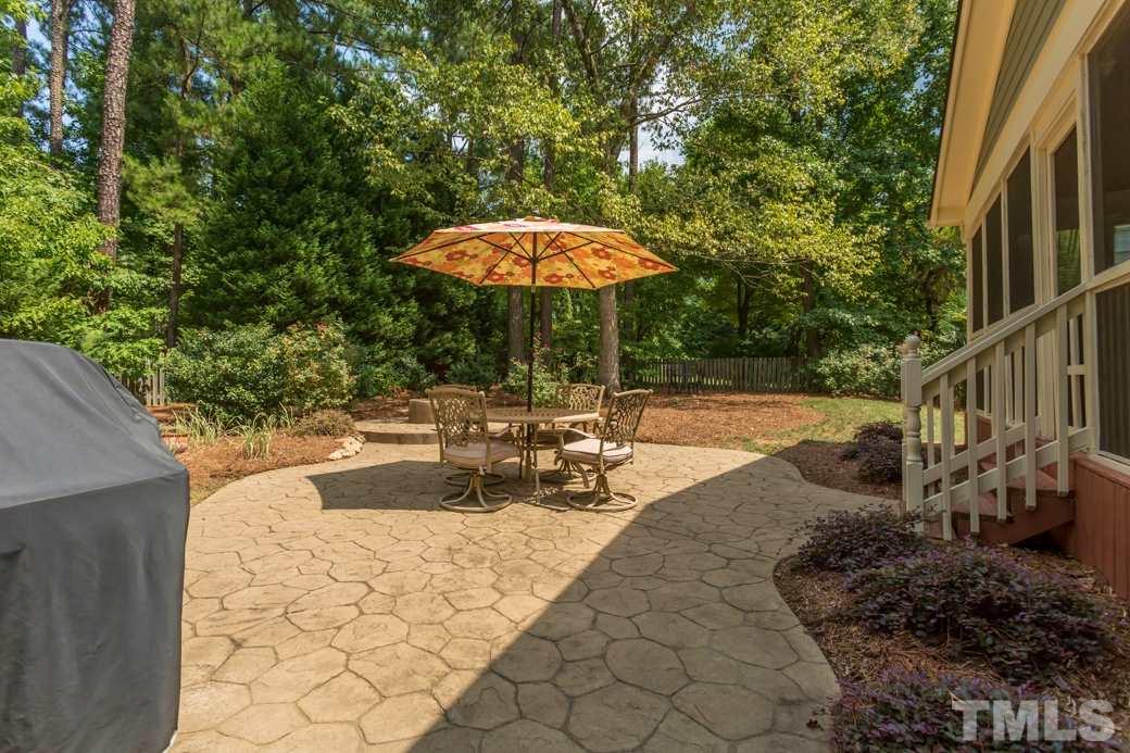 5220 Calverton Drive Raleigh, NC 27613 - Photo 22 of 25 a view of a swimming pool with a patio