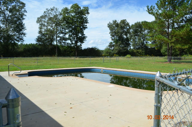 5965 Buckward Road Baker, FL 32531 - Photo 3 of 27 a view of a backyard