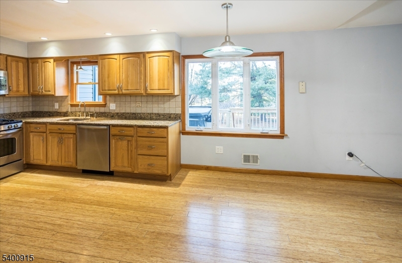 2 Bernard Court Lebanon, NJ 08833 - Photo 12 of 37 a view of a kitchen with granite countertop stainless steel appliances and a window