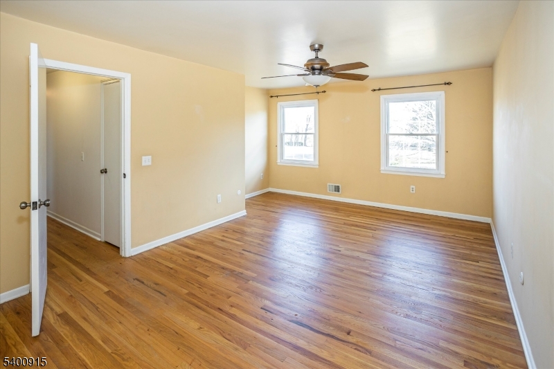 2 Bernard Court Lebanon, NJ 08833 - Photo 19 of 37 a view of an empty room with wooden floor and a window
