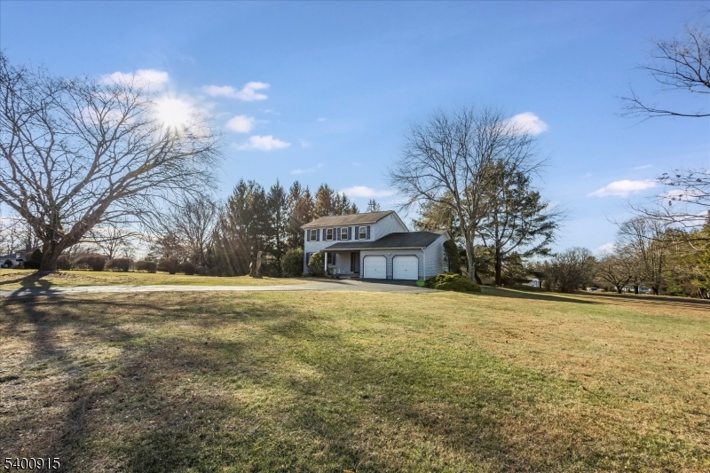 2 Bernard Court Lebanon, NJ 08833 - Photo 2 of 37 a yellow house with trees in front of it
