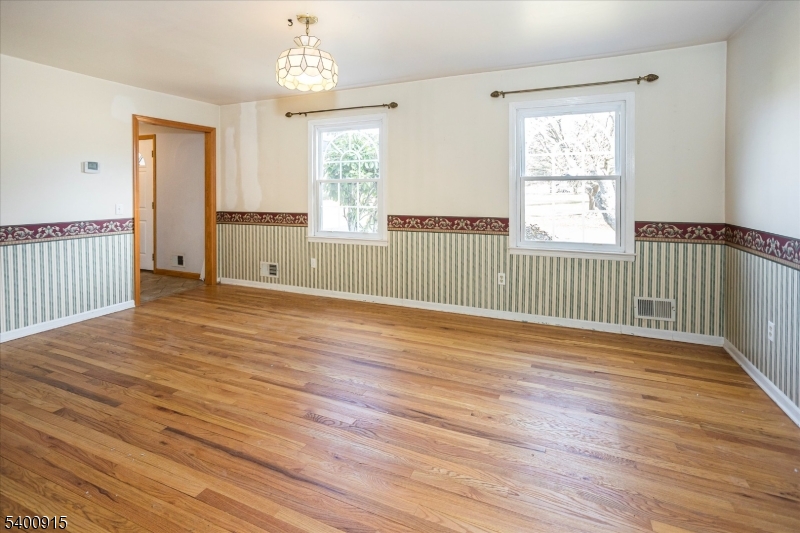 2 Bernard Court Lebanon, NJ 08833 - Photo 6 of 37 a view of an empty room with wooden floor and a window
