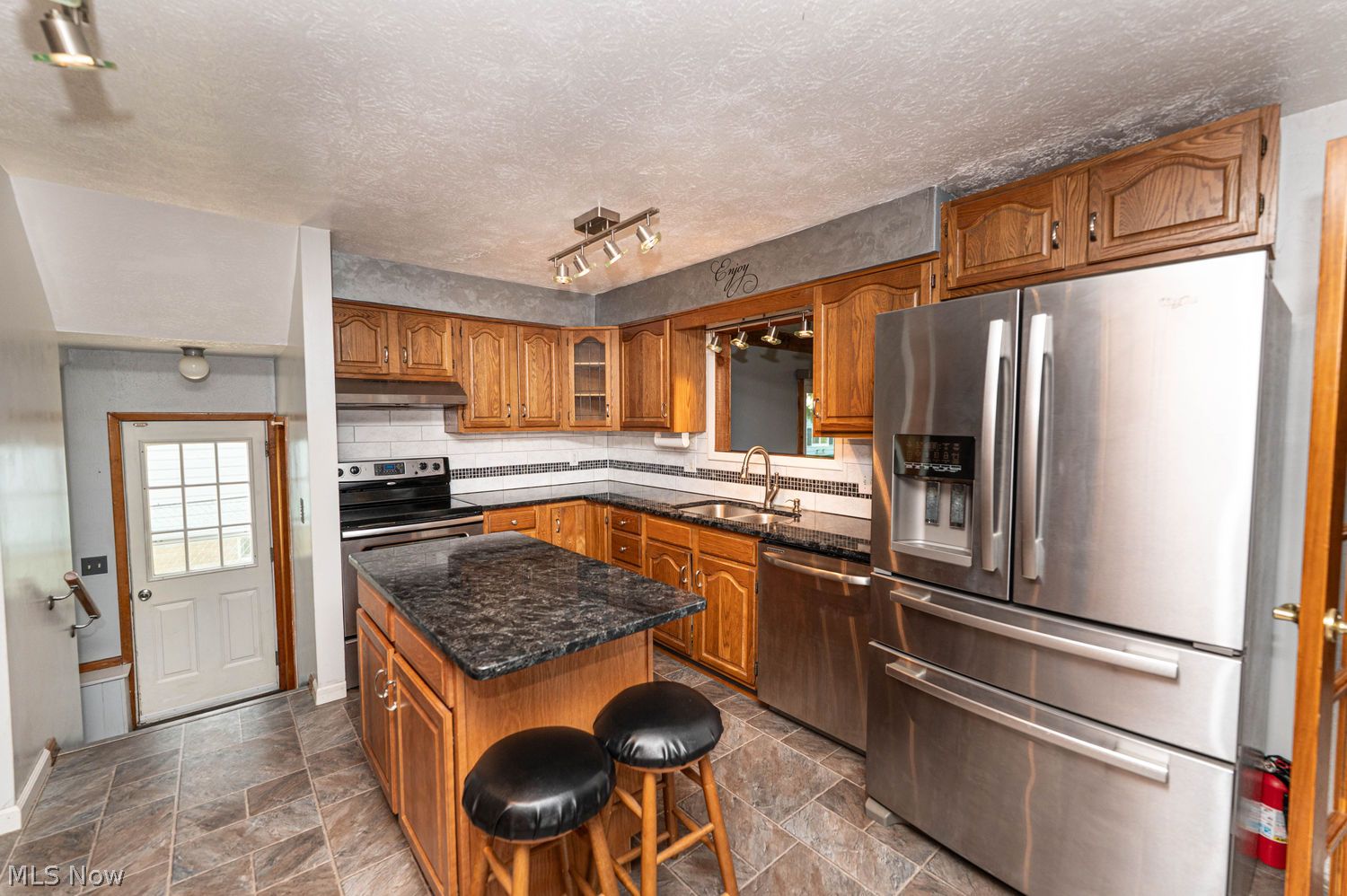 916 Center Road Eastlake, OH 44095 - Photo 7 of 39 Large eat-in kitchen with stainless steel appliances and track lighting
