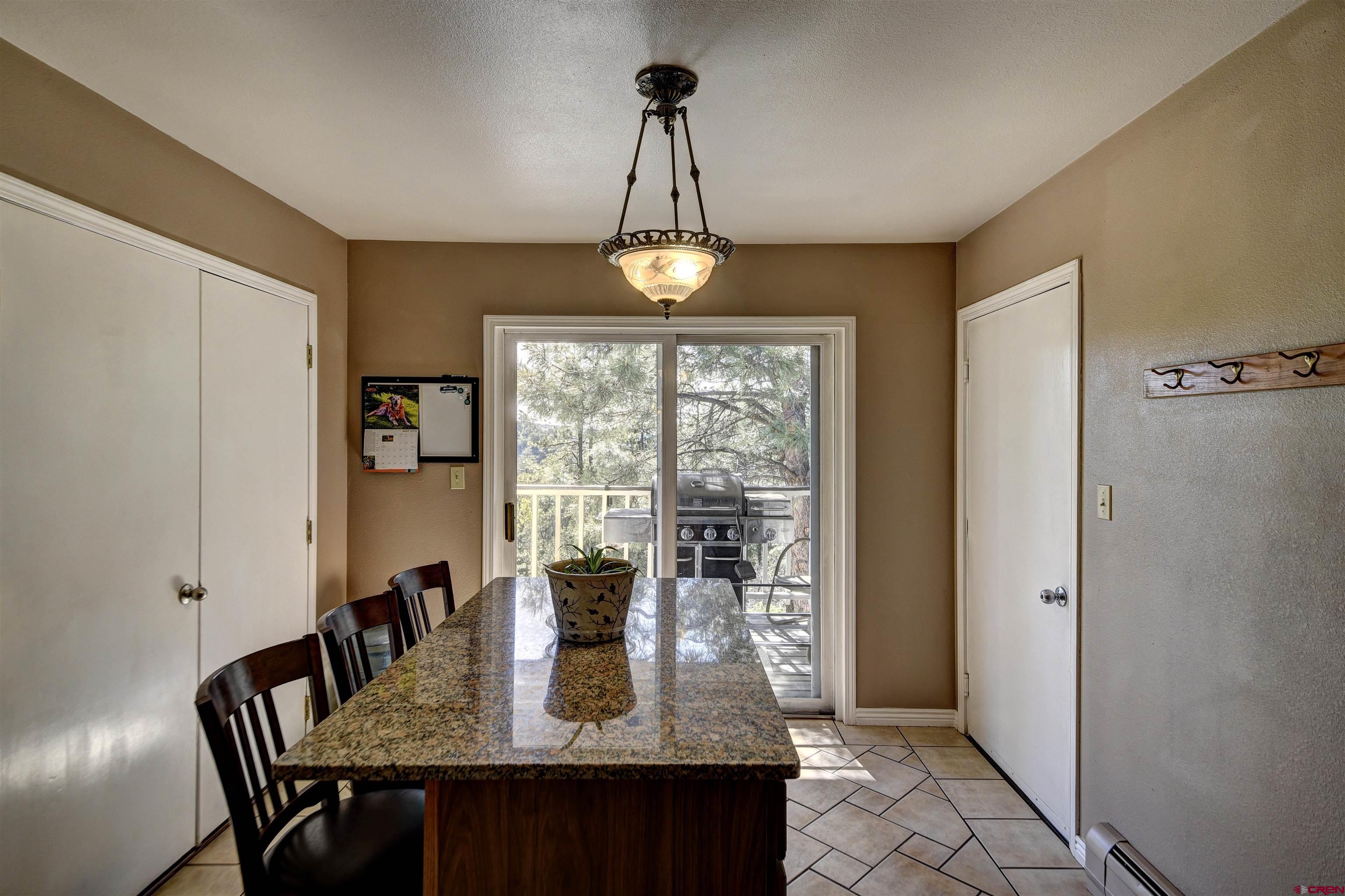 1172 Ridge Road Durango, CO 81303 - Photo 17 of 28 a view of a dining room with furniture window and wooden floor