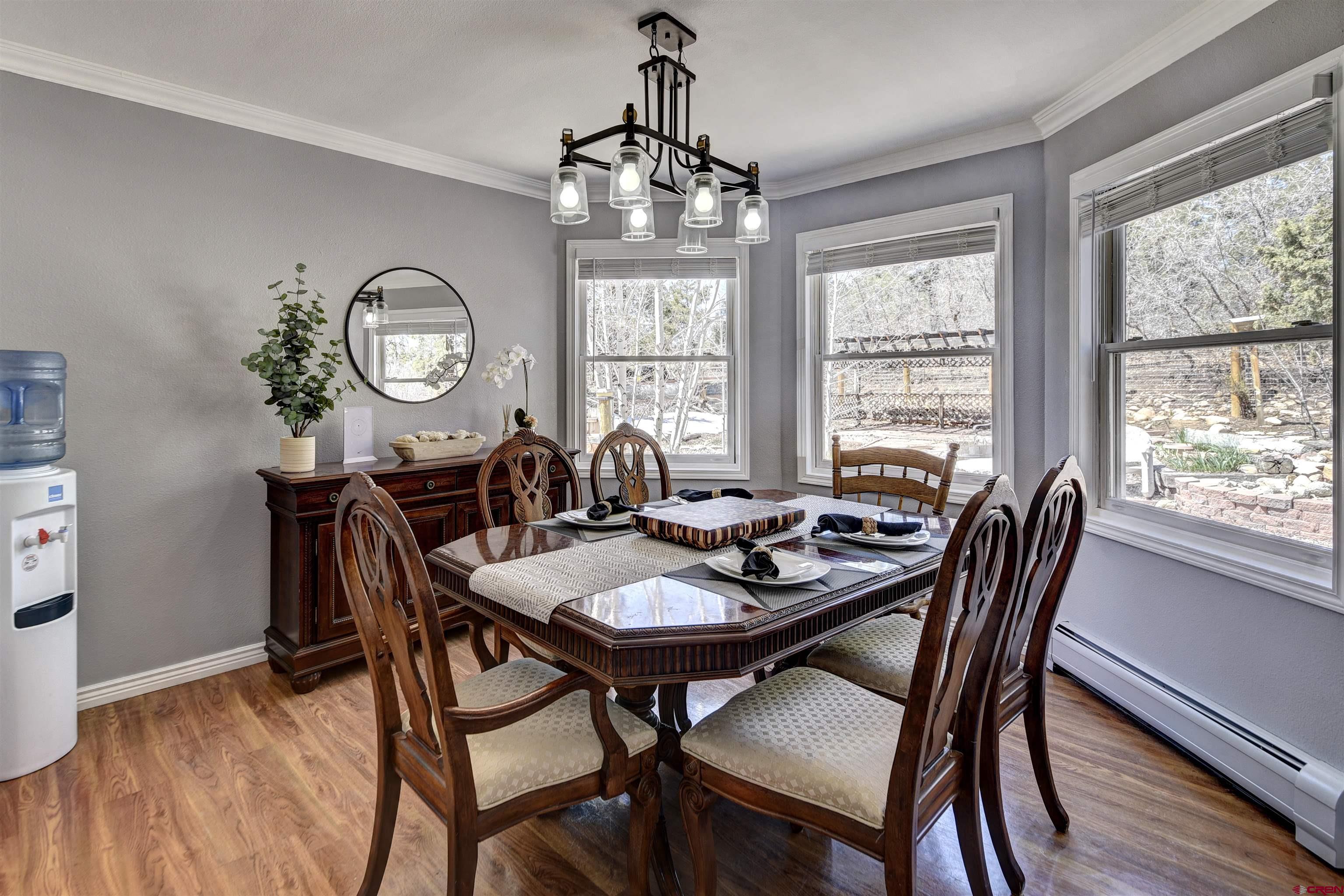 1172 Ridge Road Durango, CO 81303 - Photo 18 of 28 a view of a dining room with furniture window and wooden floor