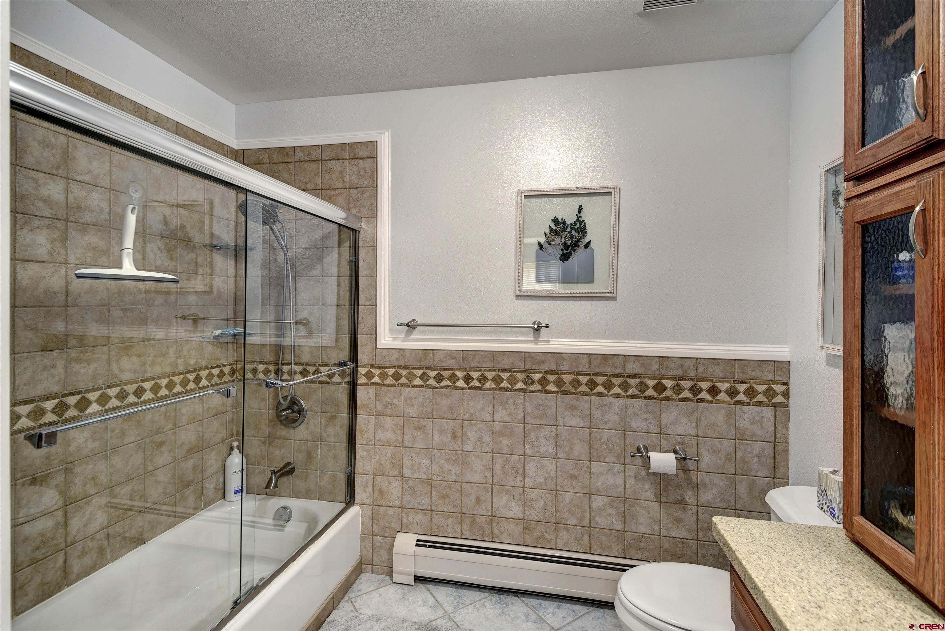 1172 Ridge Road Durango, CO 81303 - Photo 26 of 28 a bathroom with a toilet and shower