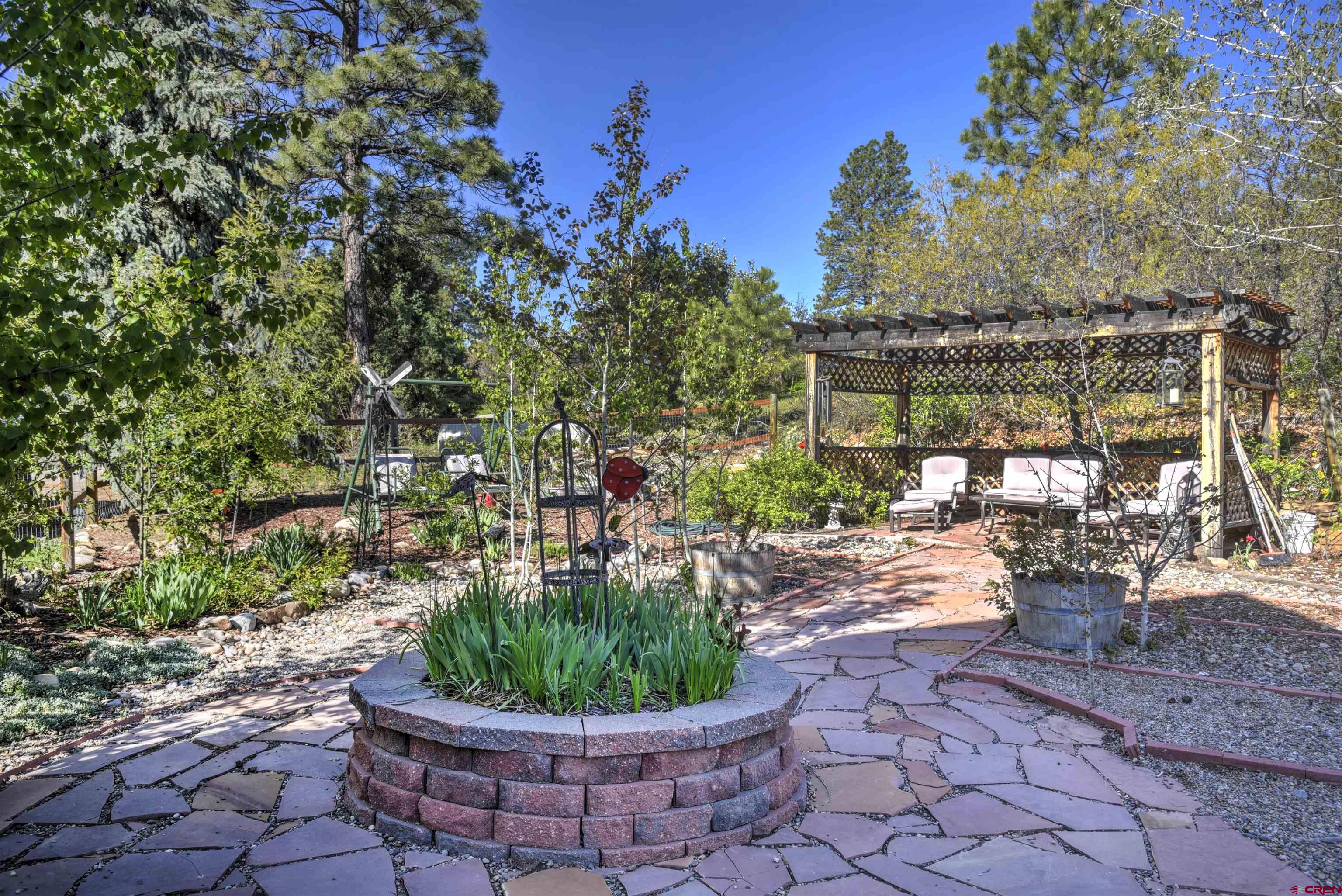 1172 Ridge Road Durango, CO 81303 - Photo 5 of 28 a view of a backyard with sitting area