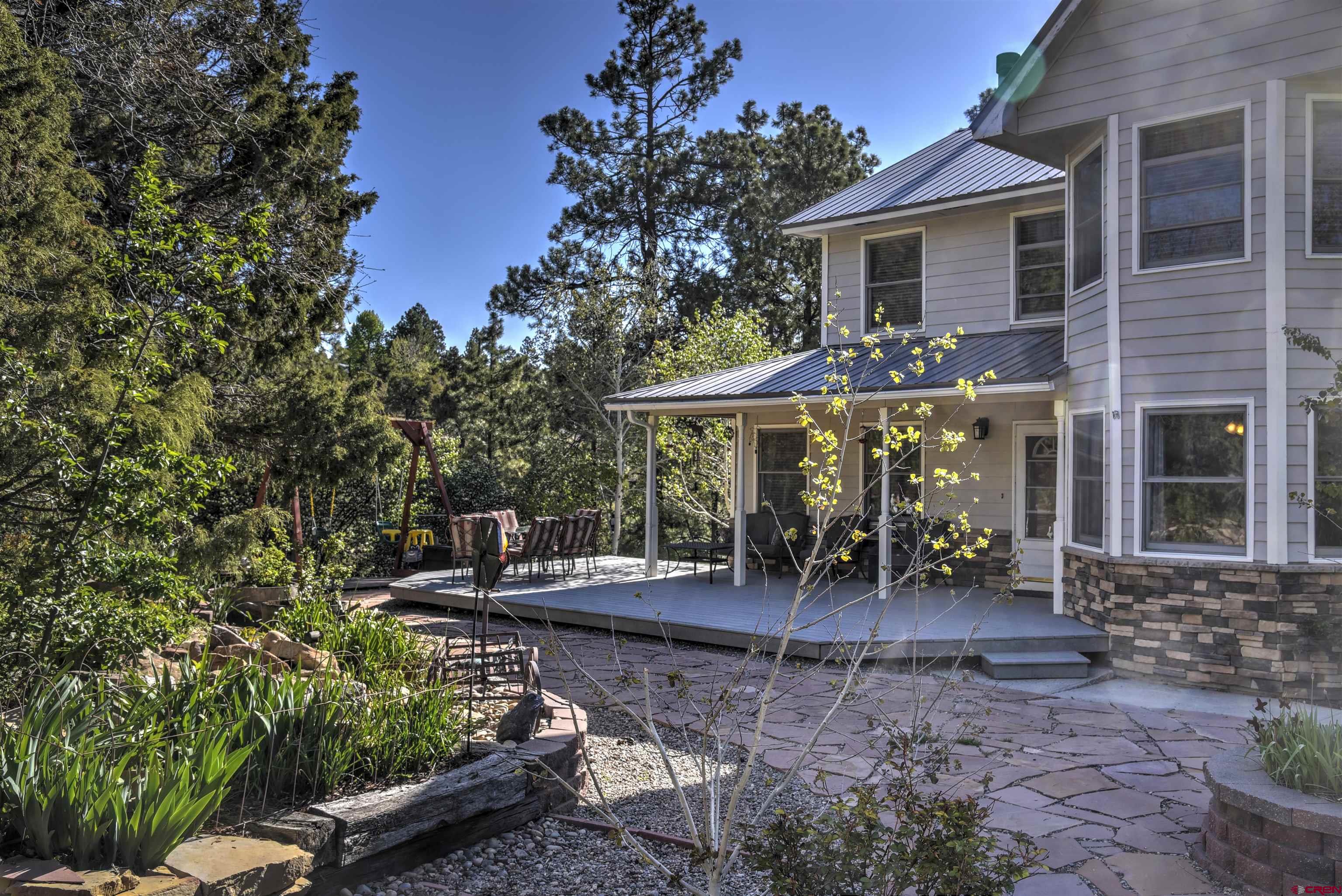 1172 Ridge Road Durango, CO 81303 - Photo 7 of 28 a view of a house with patio chairs and couches