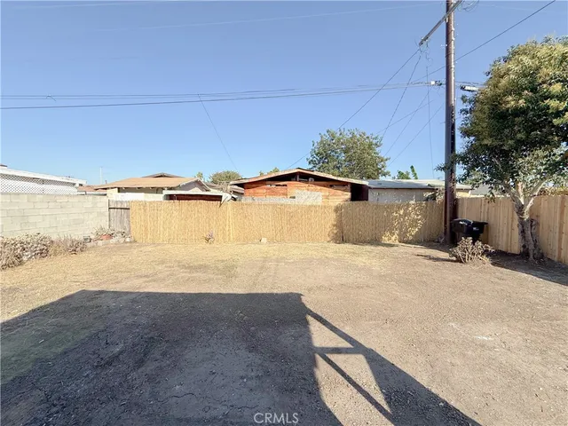 a view of a house with a snow in the background