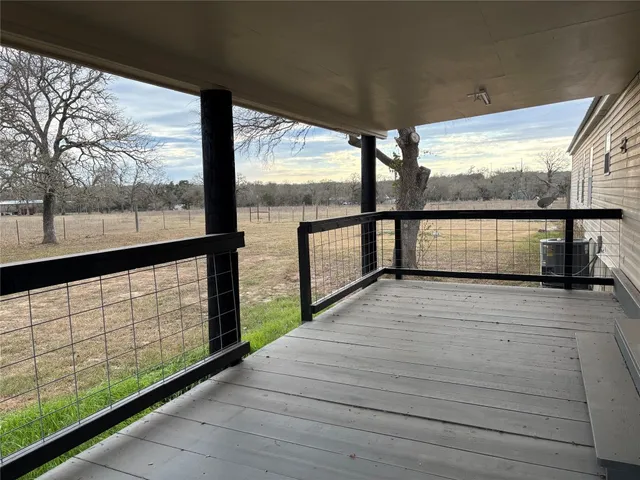 a view of a closet with wooden floor