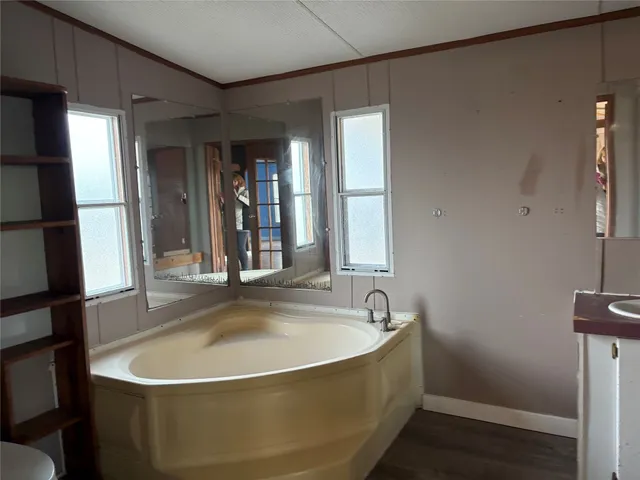 a white bath tub sitting in a bathroom