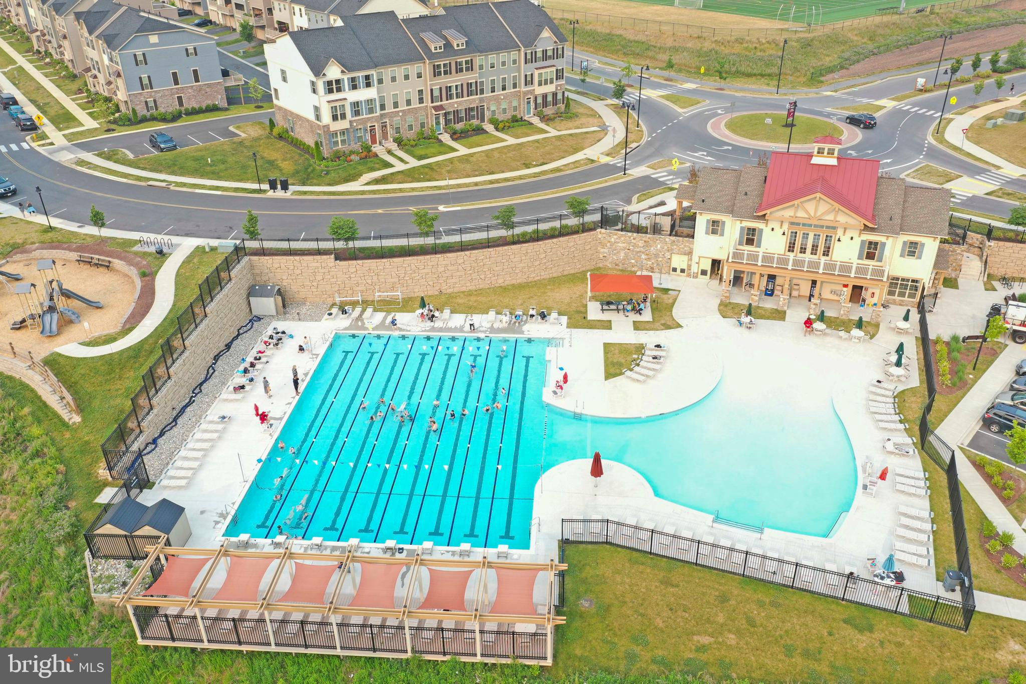 5920 Pecking Stone Street New Market, MD 21774 - Photo 39 of 72 a view of swimming pool with a dining table and chairs