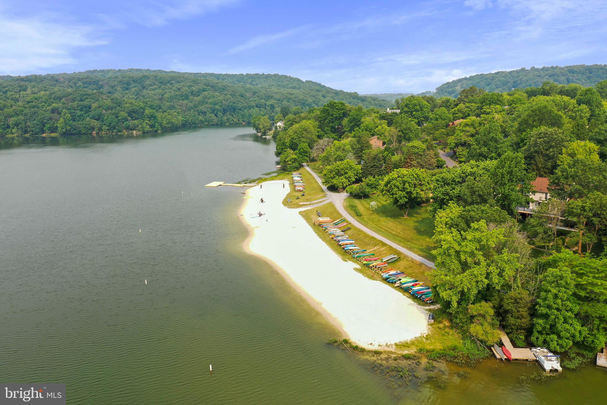5920 Pecking Stone Street New Market, MD 21774 - Photo 44 of 72 a view of a lake with a yard