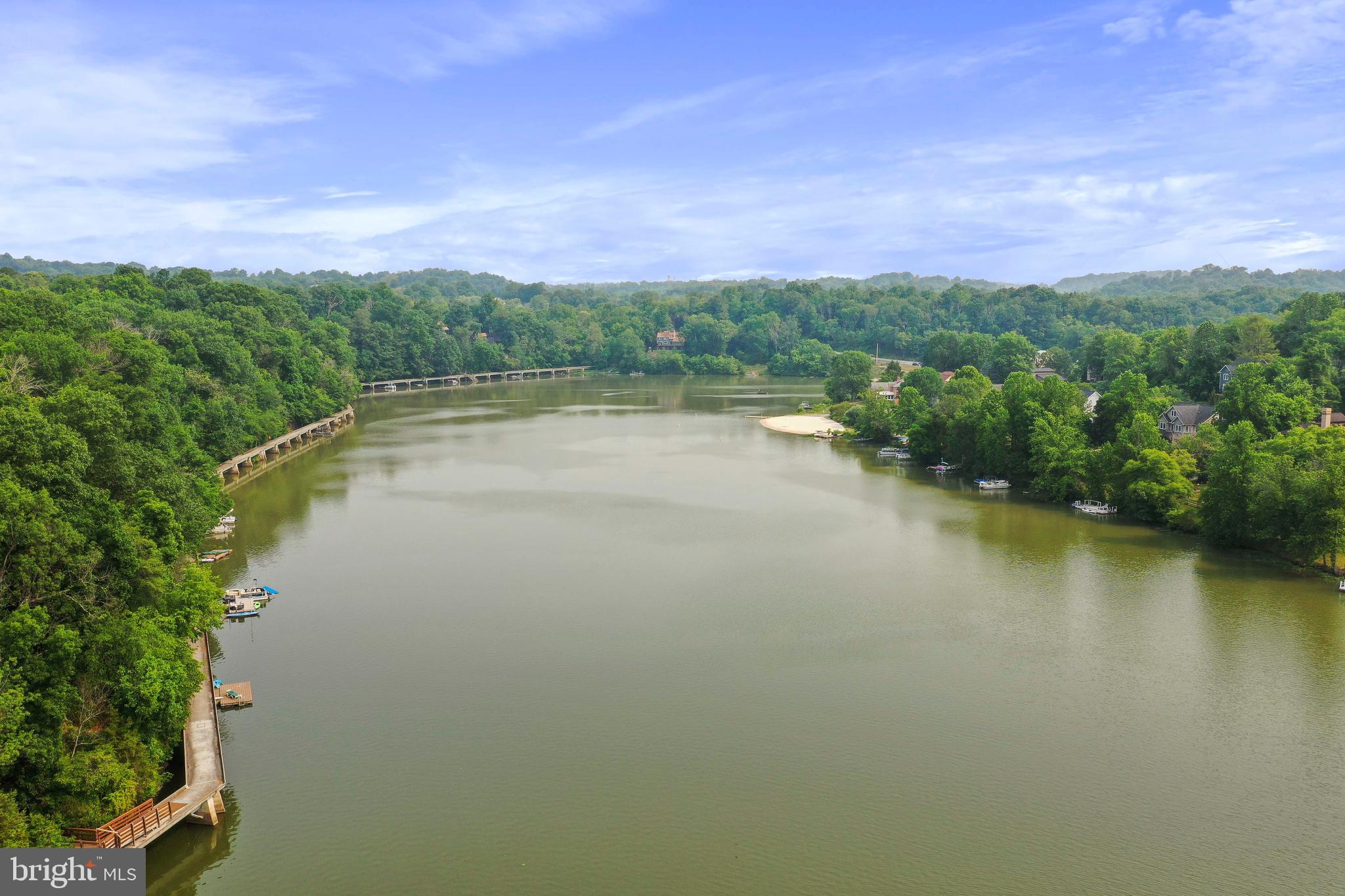 5920 Pecking Stone Street New Market, MD 21774 - Photo 45 of 72 a view of a lake with houses in the back