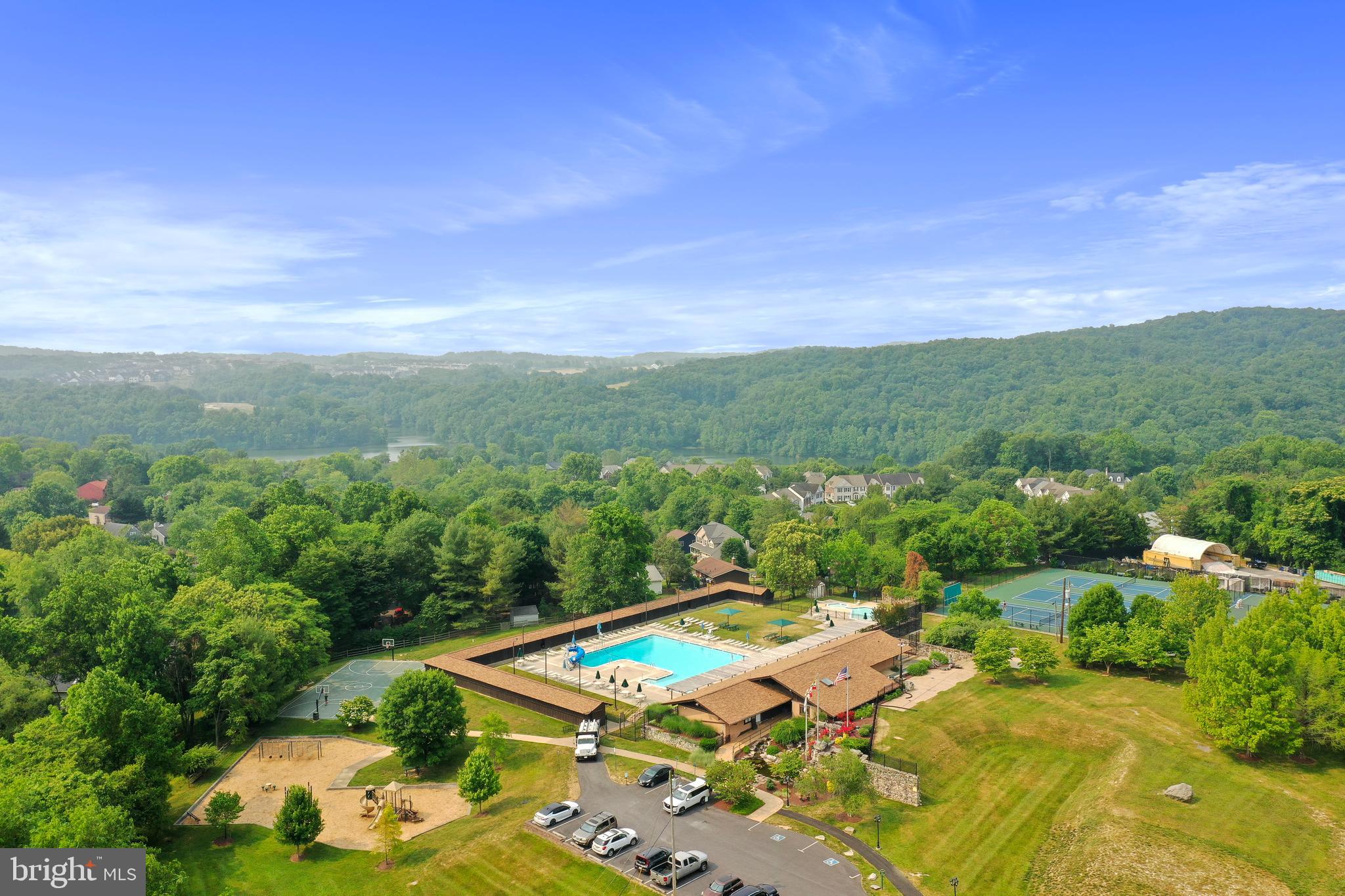 5920 Pecking Stone Street New Market, MD 21774 - Photo 56 of 72 a view of a swimming pool with a yard