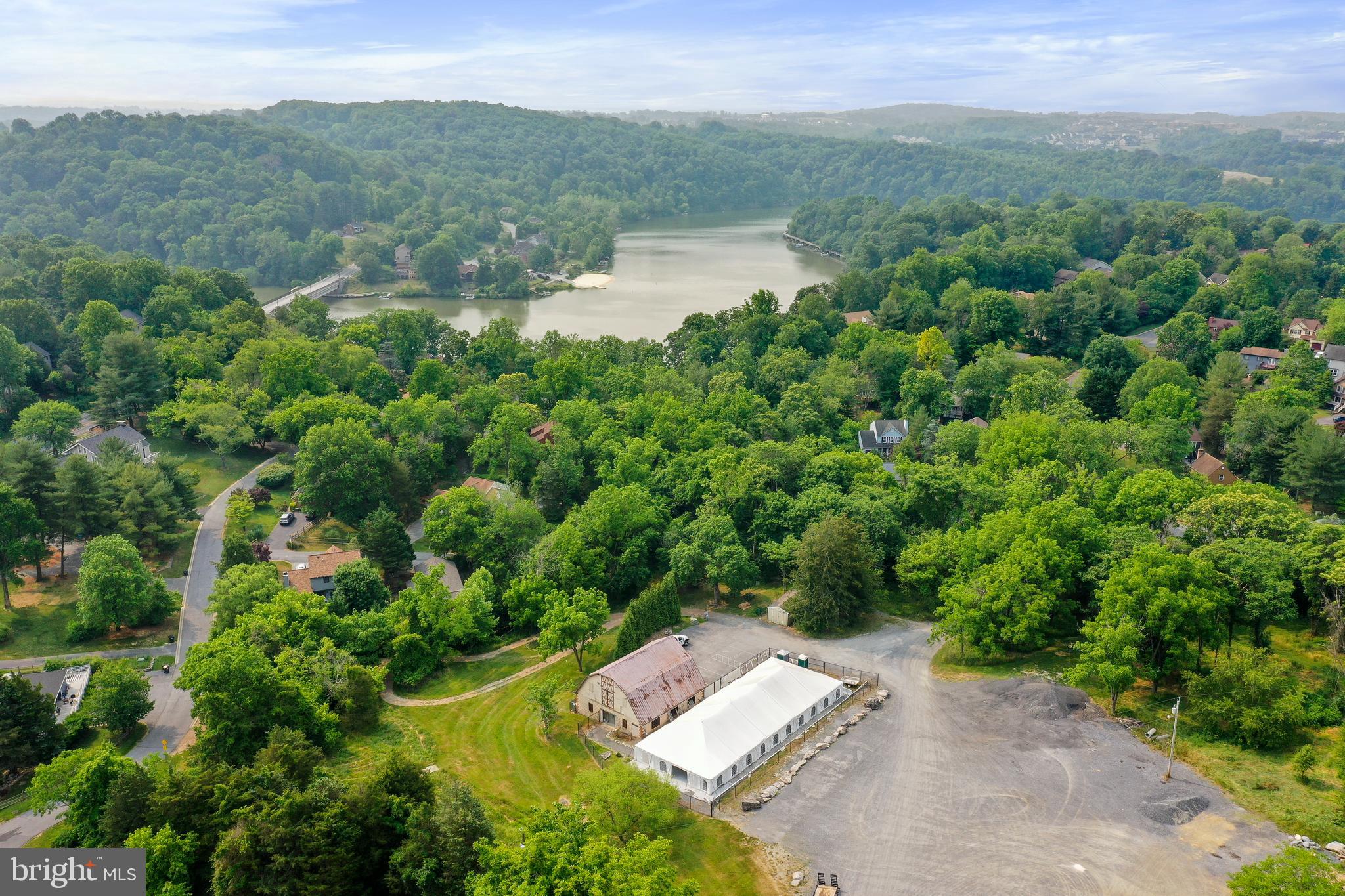 5920 Pecking Stone Street New Market, MD 21774 - Photo 57 of 72 a view of a lake with a yard