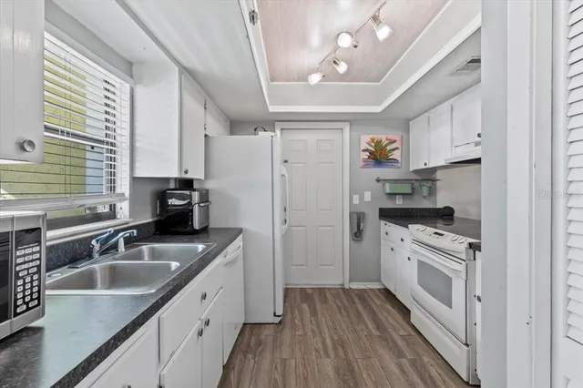 a view of a livingroom with furniture and a fireplace