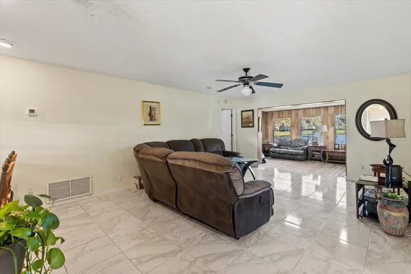 a living room with furniture and a window