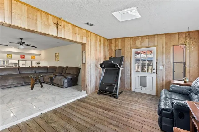 a bedroom with a bed and a mirror