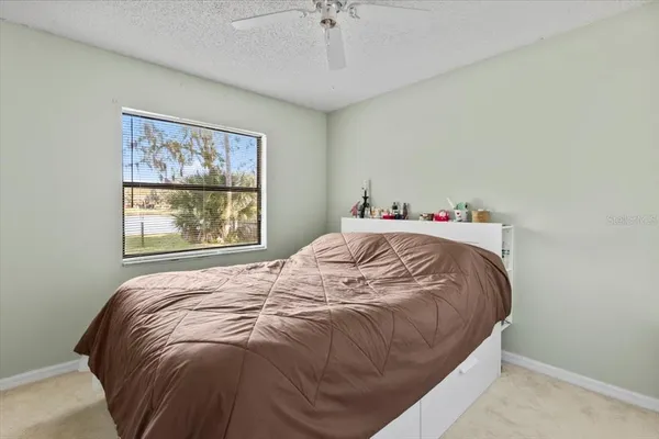 a bathroom with a toilet a sink and vanity
