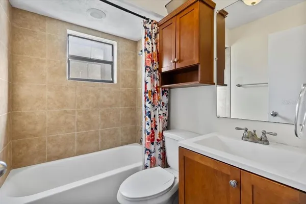 a view of a house with a yard covered with snow