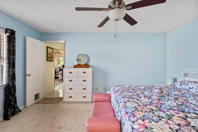 a view of a swimming pool with an outdoor space and seating area