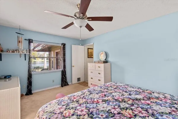a view of a swimming pool with an outdoor space and seating area