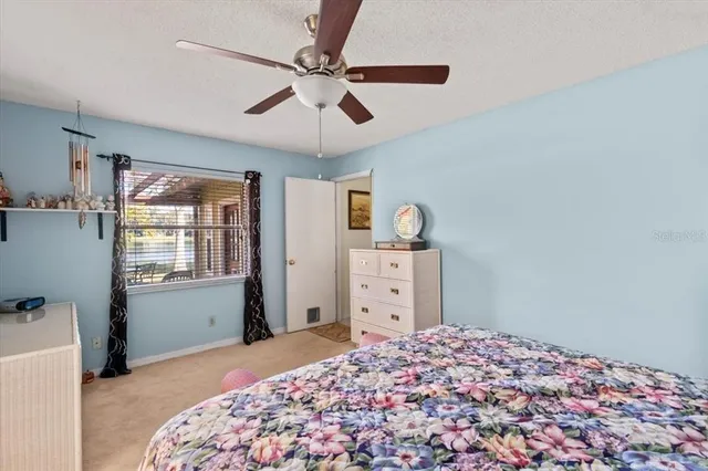 a view of a swimming pool with an outdoor space and seating area