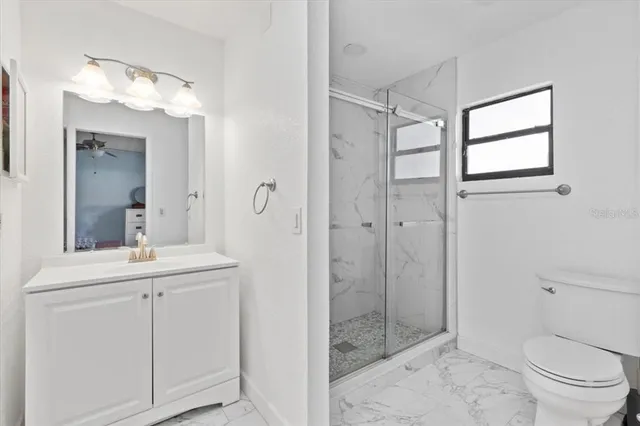 a view of a swimming pool with an outdoor space and seating area