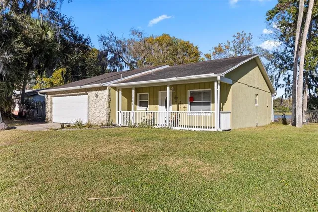 a view of a dining area with furniture and a clock
