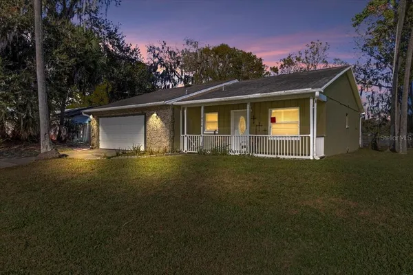 a view of a dining area with furniture and a clock