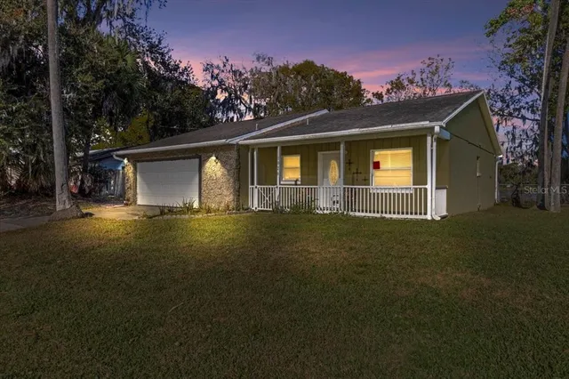a view of a dining area with furniture and a clock