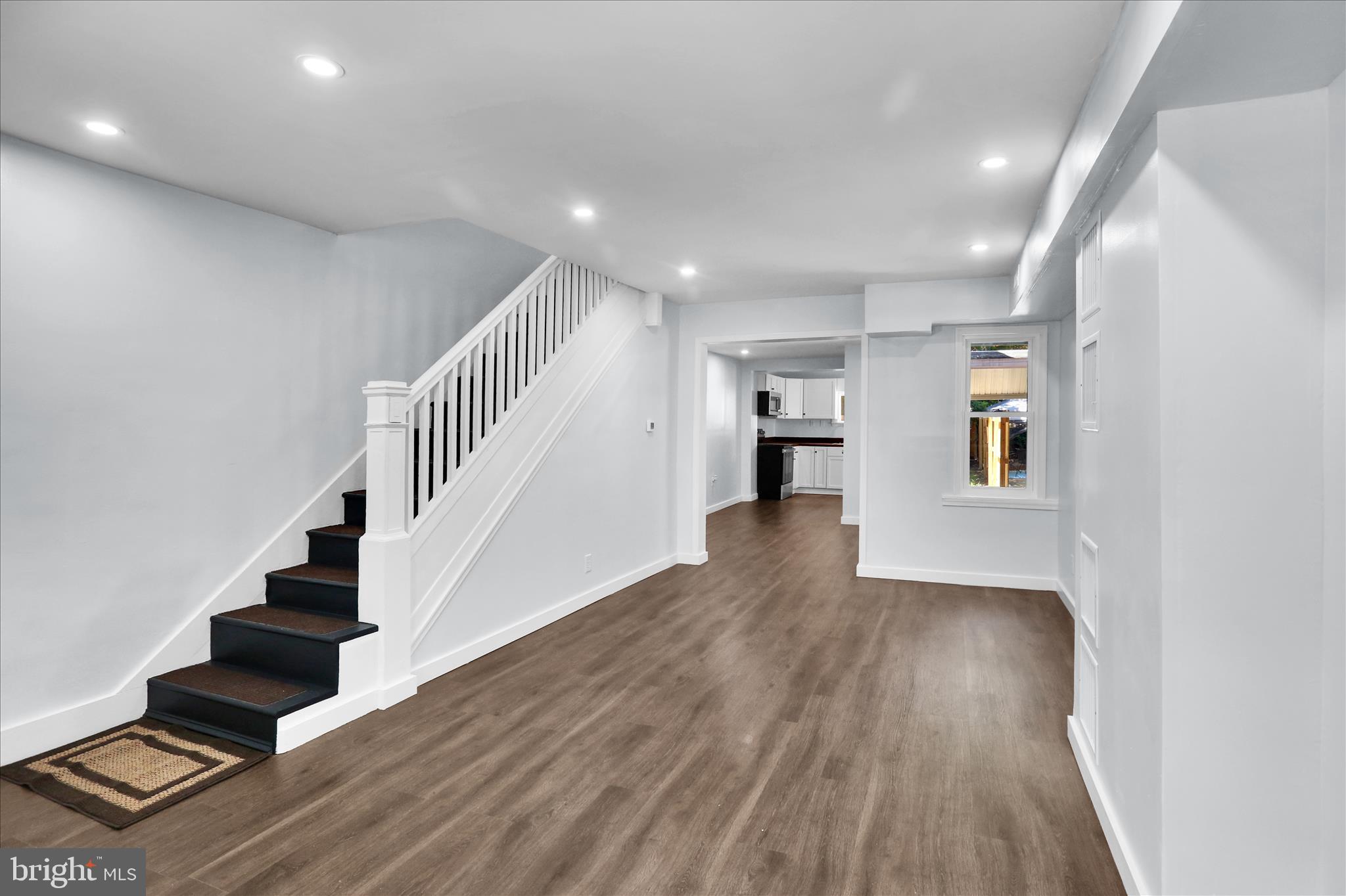 513 Manor Street Lancaster, PA 17603 - Photo 4 of 37 a view of entryway and hall with wooden floor