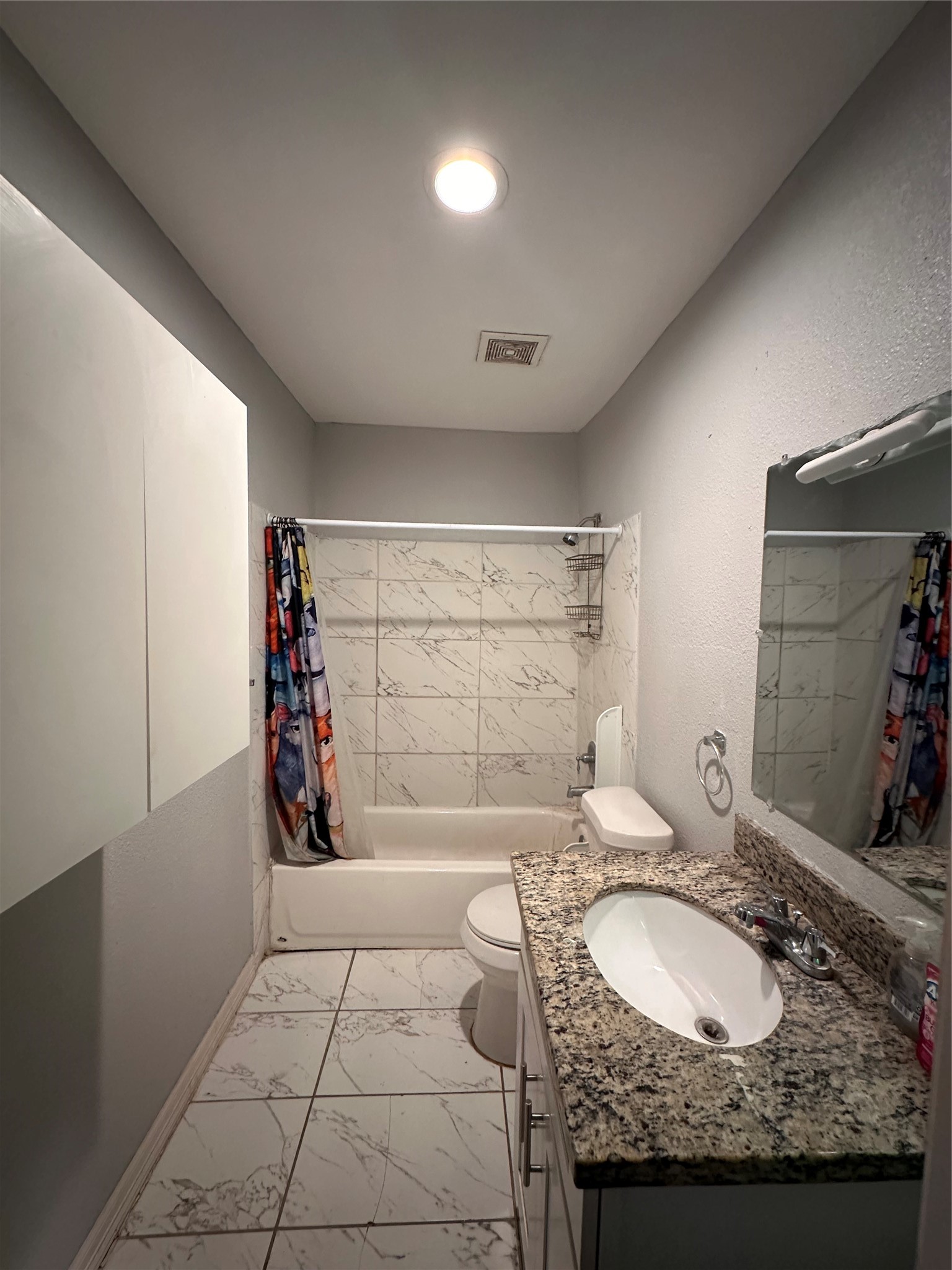 4802 Eppes Street Houston, TX 77021 - Photo 12 of 34 a bathroom with a granite countertop sink a toilet and shower