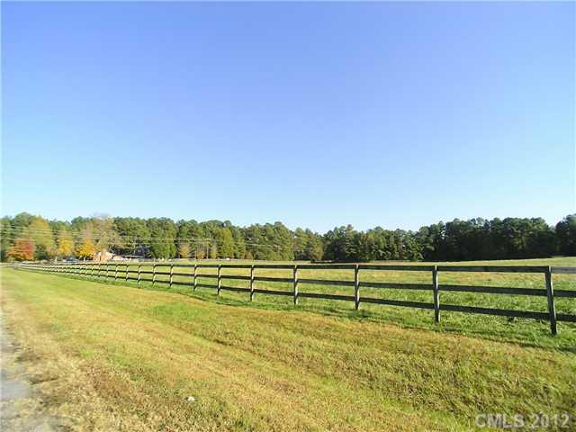 9064 Stacy Howie Road Indian Land, SC 29707 - Photo 2 of 16 a view of a golf course with a lake