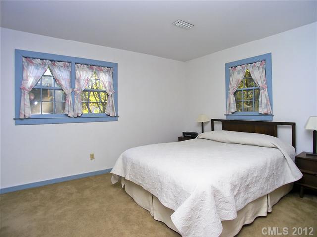9064 Stacy Howie Road Indian Land, SC 29707 - Photo 13 of 16 a bedroom with a bed and a window
