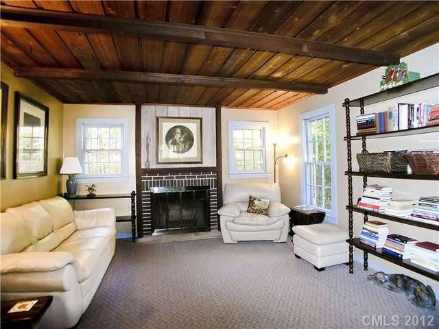 9064 Stacy Howie Road Indian Land, SC 29707 - Photo 14 of 16 a living room with furniture and a fireplace