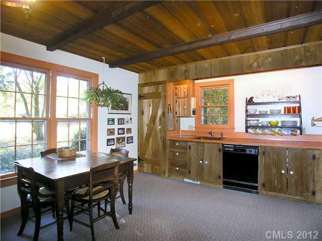 9064 Stacy Howie Road Indian Land, SC 29707 - Photo 15 of 16 a kitchen with a sink and wooden cabinets